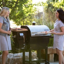 Camp Chef Woodwind 24 Wi-Fi & Bluetooth Controlled 24-Inch Pellet Grill -Kitchen BBQ Sale Camp Chef Woodwind 24 Wi Fi and Bluetooth Pellet Grill PG24CL Lifestyle Side View