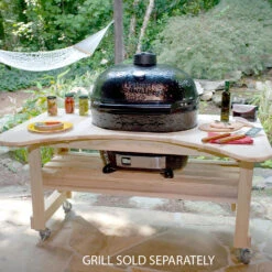 Primo Curved Cypress Kamado Table For Primo Oval XL With Ceramic Feet -Kitchen BBQ Sale Primo Curved Cypress Kamado Table for Primo Oval XL 600 Lifestyle Image