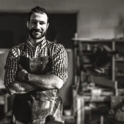 Prism Hardscapes Pebble 56-Inch 65,000 BTU Natural Gas Fire Pit Bowl - Cafe 16 Prism Hardscapes Pebble 56-Inch 65,000 BTU Natural Gas Fire Pit Bowl - Cafe -Kitchen BBQ Sale Prism Hardscape Craftsmanship Lifestyle Image