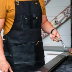 The Apres Supply Co. The Premium Grill Master BBQ Apron - Waxed Recycled Cotton With Leather Trim -Kitchen BBQ Sale apres supply co premium grillmaster lifestyle